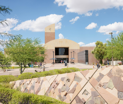 Photo of the fron t of Tempe Public Library with public art sculpture on a sunny day.